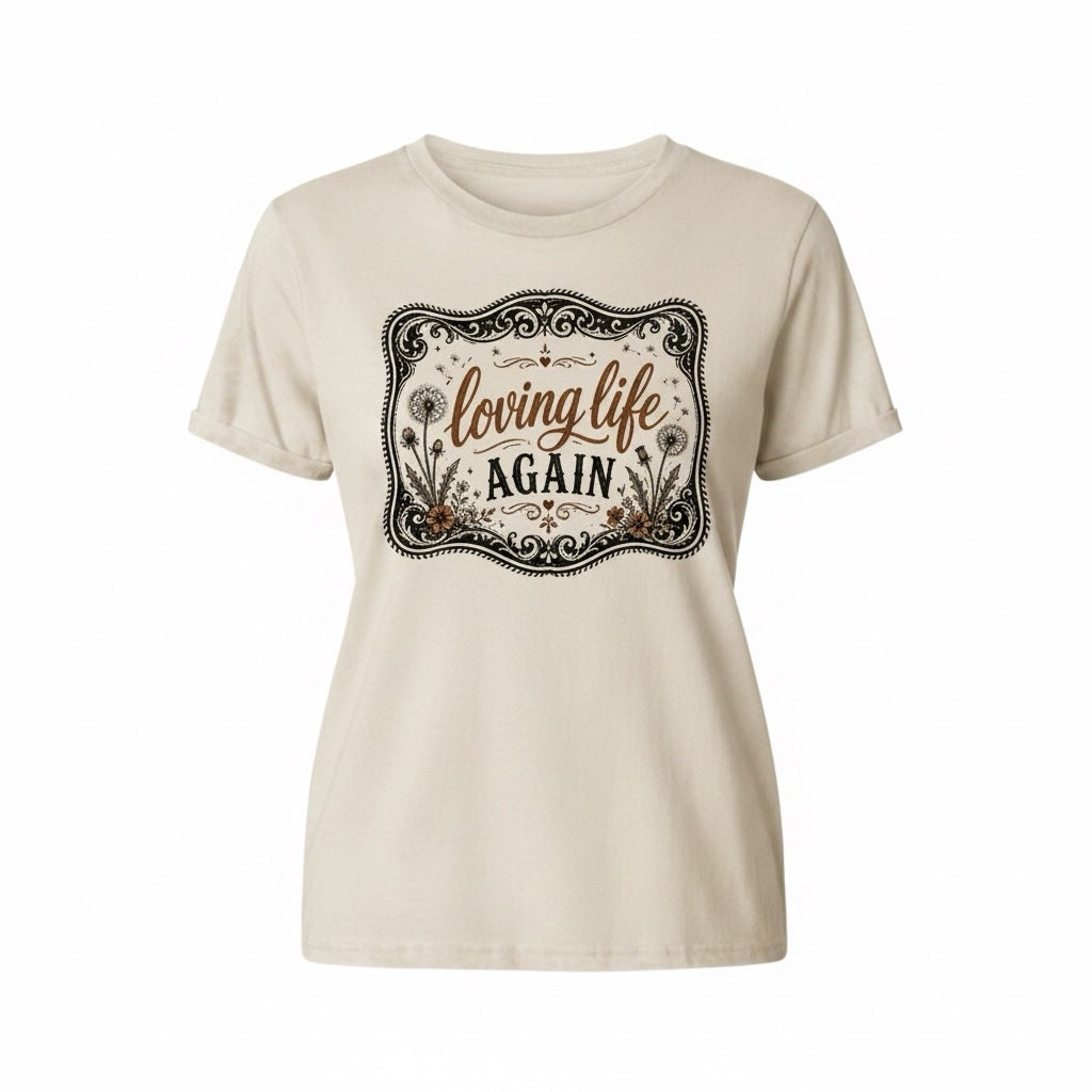 Southern Charm Design Works cream crewneck t-shirt featuring a vintage dandelion graphic and Loving Life Again text.